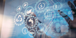 Sustainable development with icons of renewable energy and natural resources preservation with environment protection inside connected gears.businessman hand working with touch screen in action